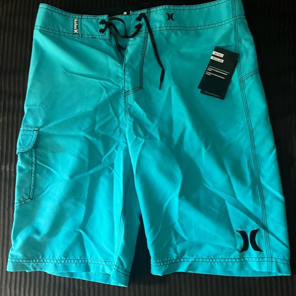 Brand new swim trunks. 2 pairs! Blue and pink.